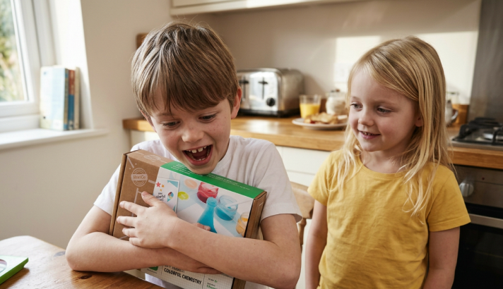 Kids opening a KiwiCo Crate